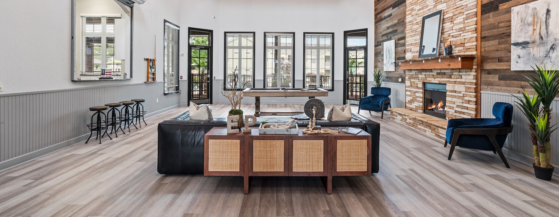 a clubroom with a couch and chairs