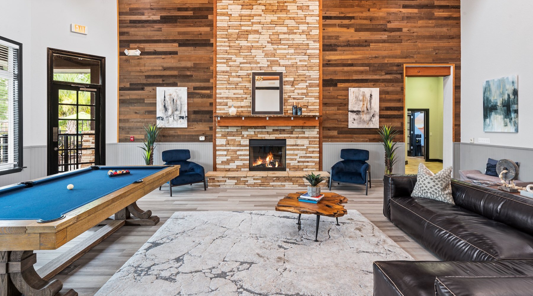 a clubroom with a pool table and a couch