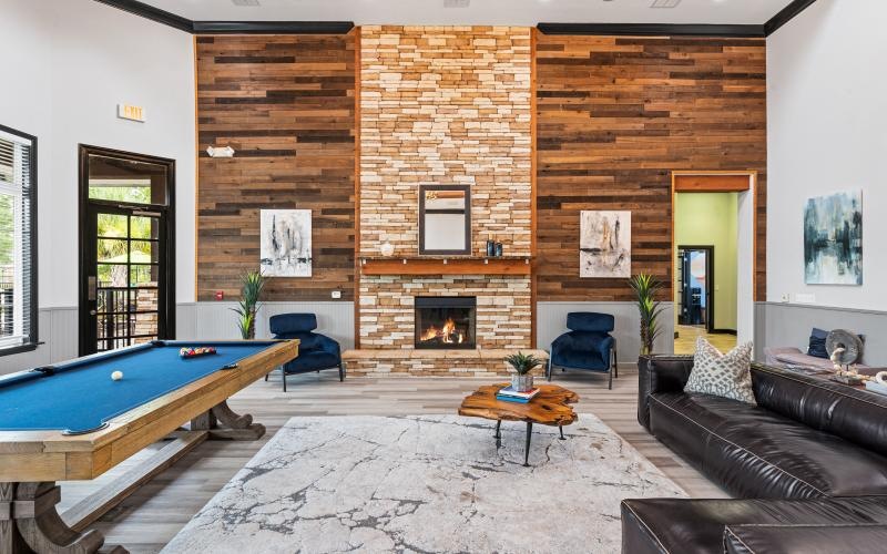a clubroom with a pool table and a couch