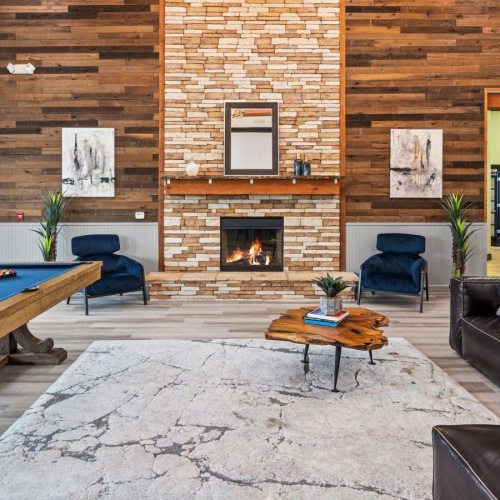a clubroom with a pool table and a couch